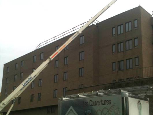 Image de travaux sur un toit plat immeuble