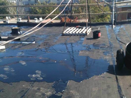 Image de travaux sur un toit plat immeuble
