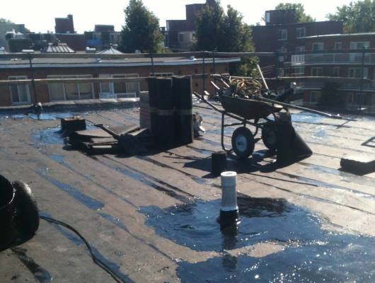 Image de travaux sur un toit plat immeuble